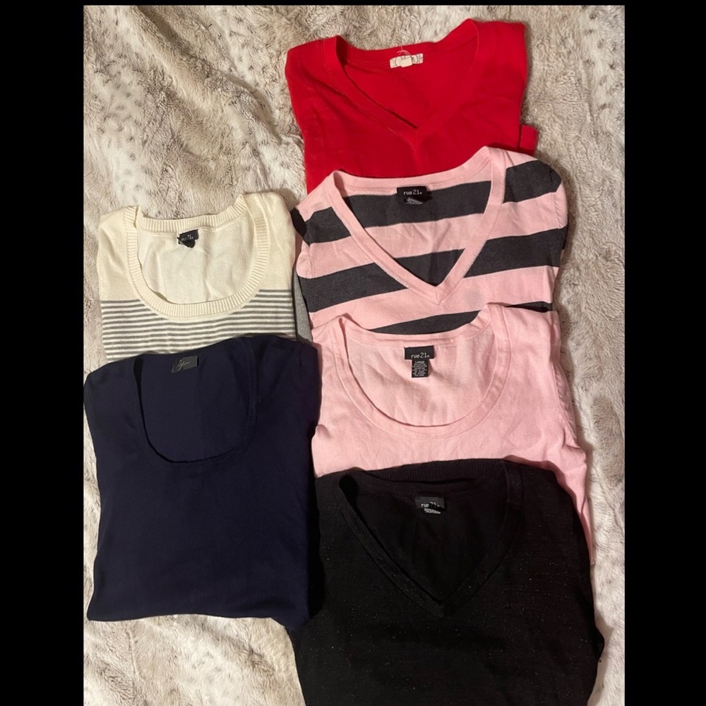Six cute sweaters. 5 large and one medium.